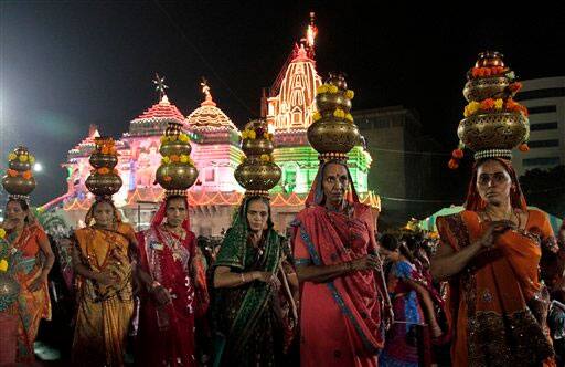 Devotees perform the Garba, a traditional dance of the western Indian state of Gujarat.