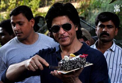 Shah Rukh Khan spotted cutting his birthday cake.