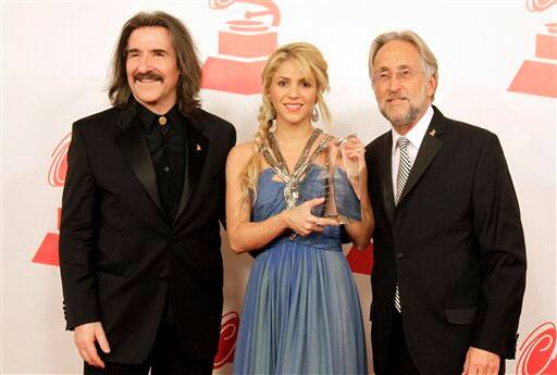 From left, Chairman of the Latin Recording Academy Luis Cobos, Shakira and President of the National Academy of Recording Arts and Sciences Neil Portnow arrive at the Latin Recording Academy Person of the Year tribute to Shakira  in Las Vegas.