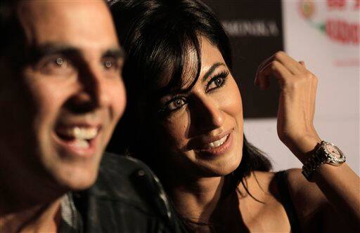 Akshay Kumar speaks as his co-star Chitrangada Singh looks on during a press conference to promote their new film Desi Boyz.