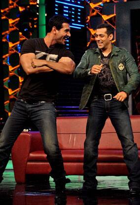 John Abraham shakes a leg with arch rival Salman Khan during `Desi Boyz` film promotion in the house of `Bigg Boss`.