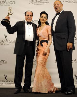 Archie Panjabi, center, presented the International Emmy Directorate Award to Subhash Chandra, left, chairman of India's Zee TV, and Citigroup Chairman Richard Parsons at the 39th International Emmy Awards in New York.