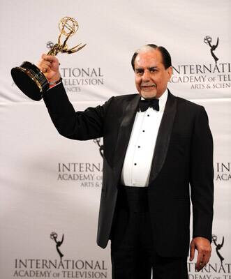 Subhash Chandra of India, Chairman of Zee Entertainment Enterprises Ltd and the Essel Group of Companies, holds The Directorate Award during the 39th International Emmy Awards in New York.