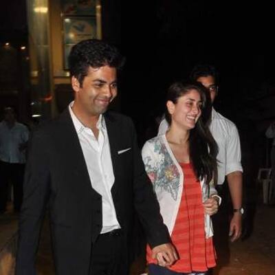 Kareena Kapoor and Karan Johar come out after watching 'The Dirty Picture' at a special screening.