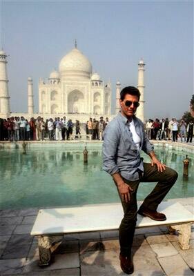 Hollywood star Tom Cruise poses in front of the landmark Taj Mahal in Agra.