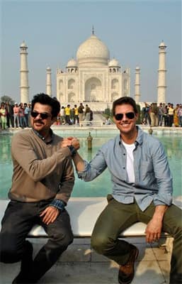 Hollywood star Tom Cruise, right, poses in front of the landmark Taj Mahal along with co-star Anil Kapoor in Agra. Cruise is in the country on a promotional tour of his new film 