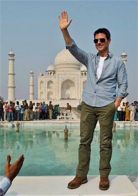 Hollywood star Tom Cruise poses in front of the landmark Taj Mahal in Agra.