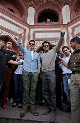 Hollywood star Tom Cruise and co-star Anil Kapoor wave to the crowd at the landmark Taj Mahal in Agra.