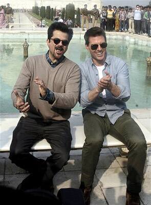 Hollywood star Tom Cruise poses in front of the landmark Taj Mahal along with co-star Anil Kapoor in Agra.