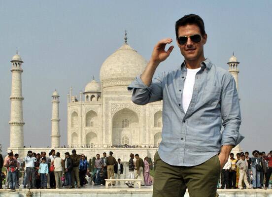 Hollywood star Tom Cruise poses in front of the landmark Taj Mahal in Agra.