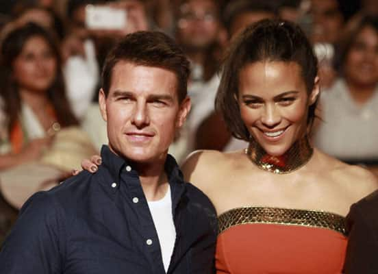 US actor Tom Cruise and US actress Paula Patton, right, pose during a special screening of their film Mission Impossible Ghost Protocol in Mumbai.