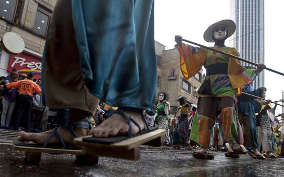 Members of the Fontibol Theater group march in the inaugural parade marking the 13th annual IberoAmerican Festival of Theater (FITB) in Bogota.