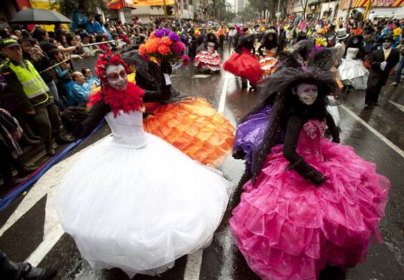 Dancers perform in the inaugural parade marking the 13th IberoAmerican Festival of Theater (FITB) in Bogota, Colombia.