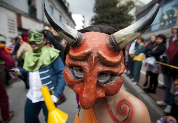 A dancer performs in the inaugural parade marking the 13th IberoAmerican Festival of Theater (FITB) in Bogota.