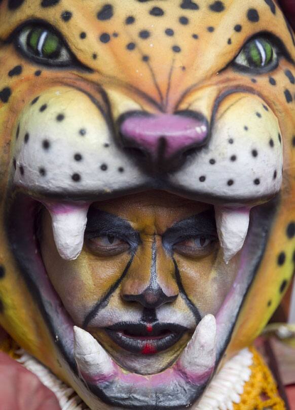 A dancer performs in the inaugural parade marking the 13th IberoAmerican Festival of Theater (FITB) in Bogota.