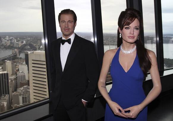 Madame Tussauds wax figures of actors Brad Pitt and Angelina Jolie stand on the observation deck of Sydney Tower in Australia.