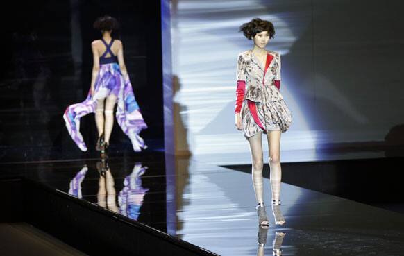 Models present creations from the Doveral collection for Autumn/Winter 2012-2013 during China Fashion Week.