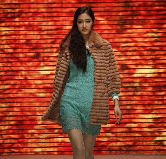 A model presents a creation from VISCAP's autumn/winter 2012-2013 collection during China Fashion Week.