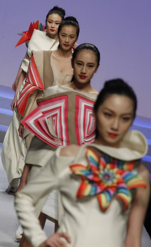 Models present creations at the BIFT Graduates Show 2012 held during China Fashion Week in Beijing.