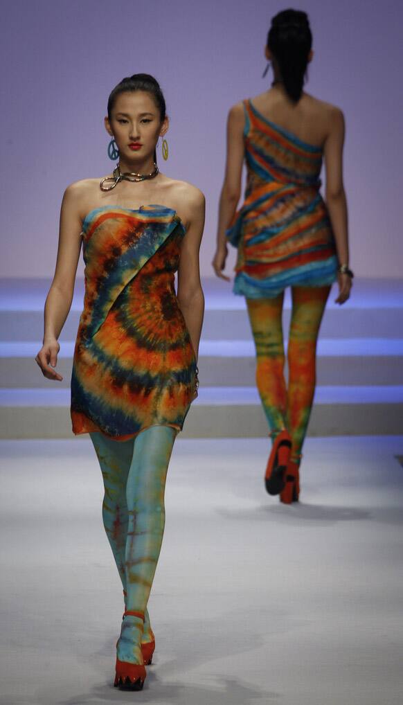 Models present creations at the BIFT Graduates Show 2012 held during China Fashion Week in Beijing.