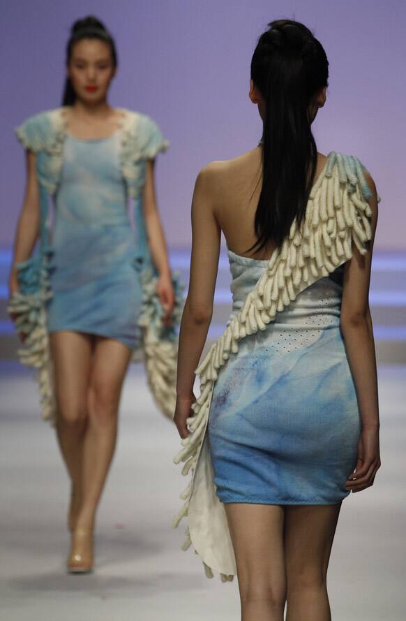 Models present creations at the BIFT Graduates Show 2012 held during China Fashion Week in Beijing.