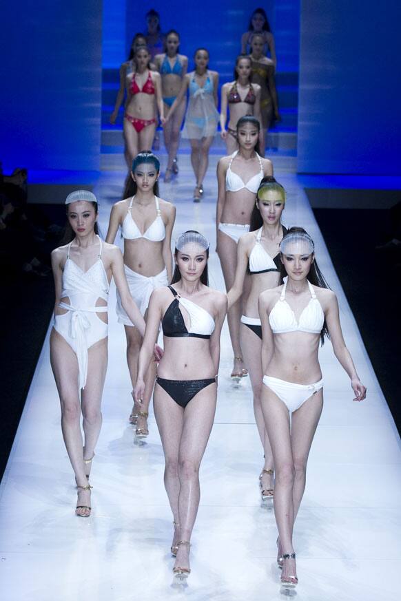 Models present creations at 2012 HOSA Swimwear Trend Fashion Show during the China Fashion Week.