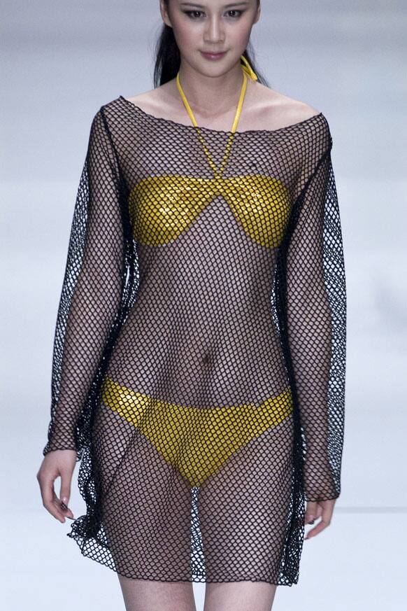 A model presents a creation at 2012 HOSA Swimwear Trend Fashion Show during the China Fashion Week.