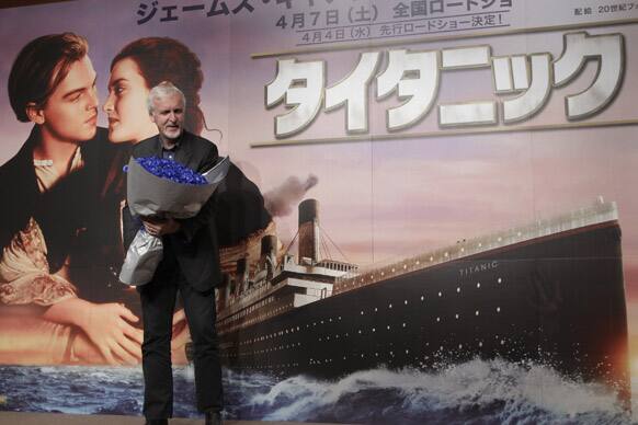 Director James Cameron poses for photographers during a press conference to promote his 3-D version of 