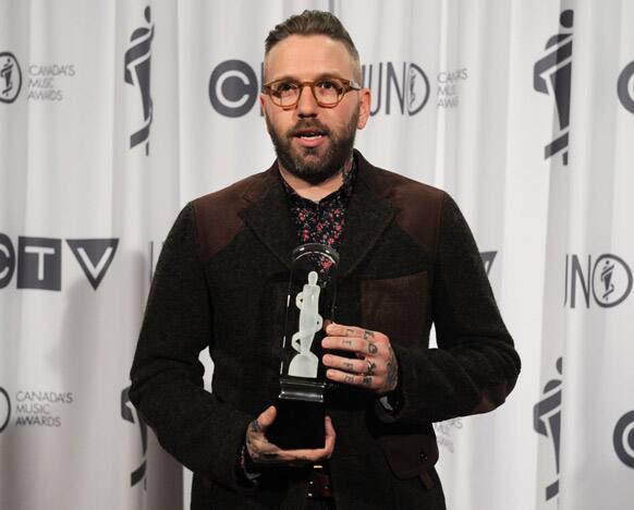 Dallas Green poses with his award for Songwriter of the Year during the Juno Awards in Ottawa.