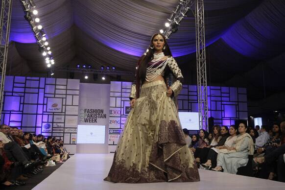 A Pakistani model presents a creation by designer Shehla Chatoor, during Fashion Week, in Karachi.