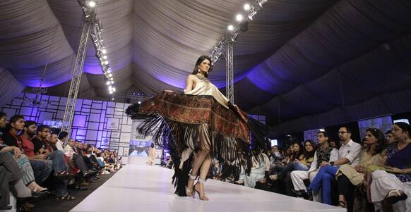 A Pakistani model presents a creation by designer Shehla Chatoor, during Fashion Week, in Karachi.