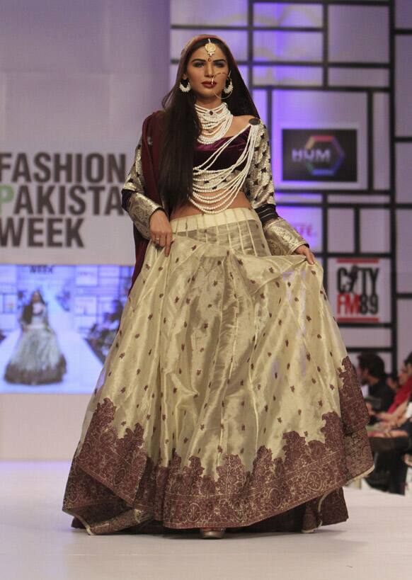 A Pakistani model presents a creation by designer Shehla Chatoor, during Fashion Week, in Karachi.