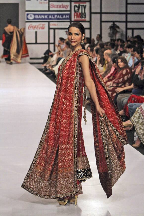 A Pakistani model presents a creation by Pakistani designer Bunto Kazmi, during Fashion Week, in Karachi.