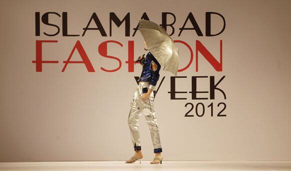 A Pakistani model presents a creation of Gift University designers during Islamabad Fashion Week.