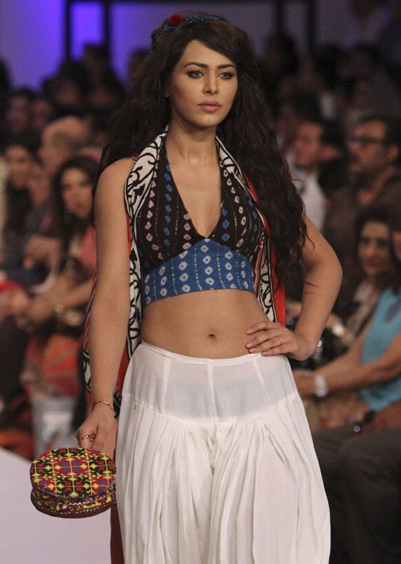 A Pakistani model presents a creation by designer Baani D, during Fashion Week, in Karachi.