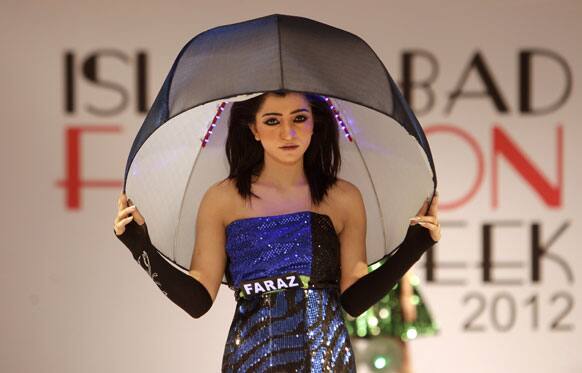 A Pakistani model presents a creation of Gift University designers during Islamabad Fashion Week.