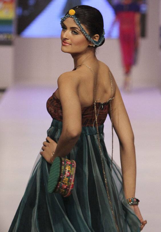 A Pakistani model presents a creation by designer Baani D, during Fashion Week, in Karachi.