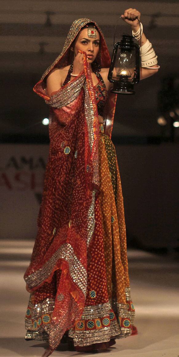 A model presents a creation of Gift University designers during Islamabad Fashion Week.