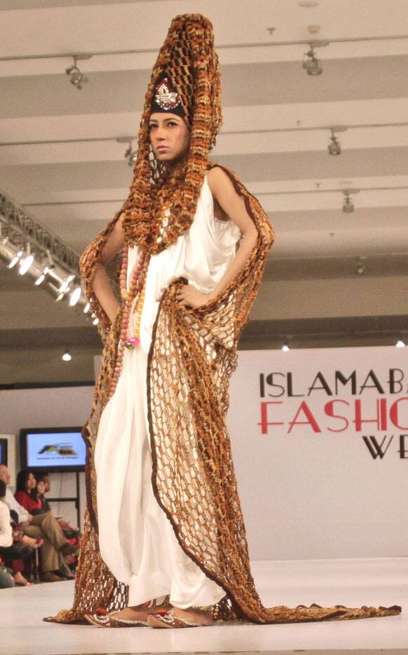 A model presents a creation of Fashion Era designers during Islamabad Fashion Week.