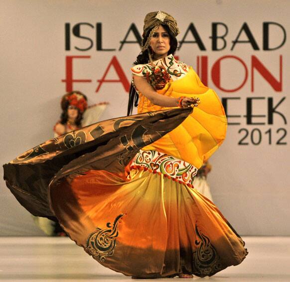 A model presents a creation of Fashion Era designers during Islamabad Fashion Week.