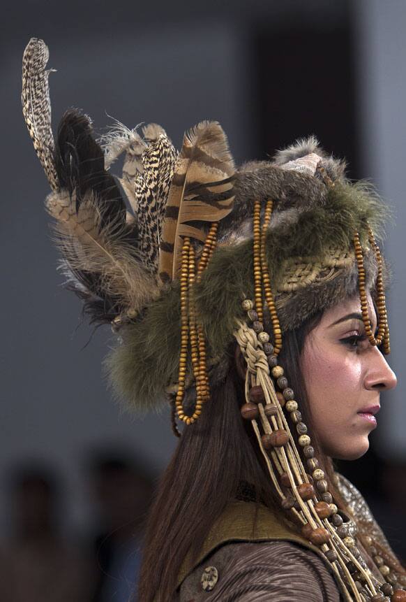 A model presents a creation of Gift University designers during a Fashion Week, in Islamabad.