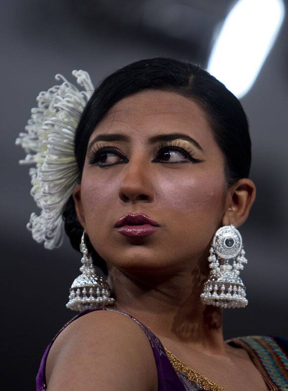 A model presents jewelry a creation of designers Arsalan and Yahseer during a Fashion Week, in Islamabad.