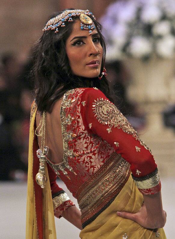 A Pakistani model presents a creation by designer Obaid Sheikh, during Bridal Couture Week in Karachi.