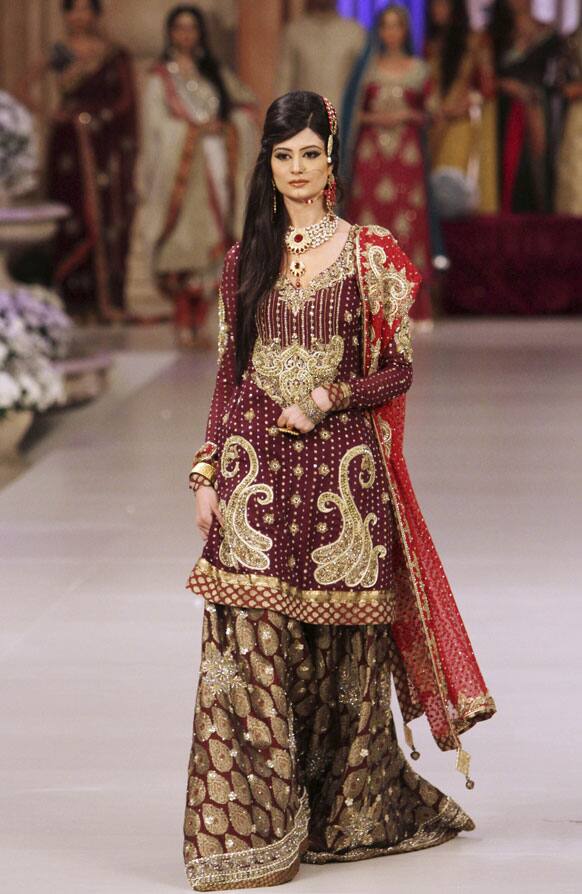 A Pakistani model presents a creation by designer Obaid Sheikh, during Bridal Couture Week in Karachi.