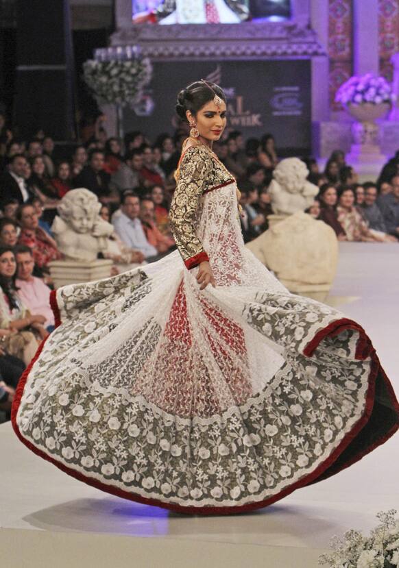 A Pakistani model presents a creation by designer Ruby shekel, during Bridal Couture Week in Karachi.