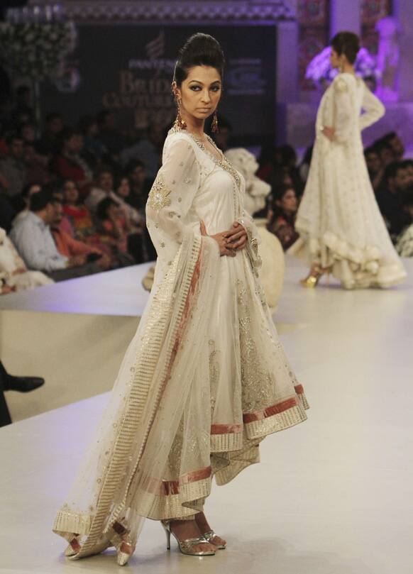 A Pakistani model presents a creation by designers Rabani and Rakha, during Bridal Couture Week in Karachi.