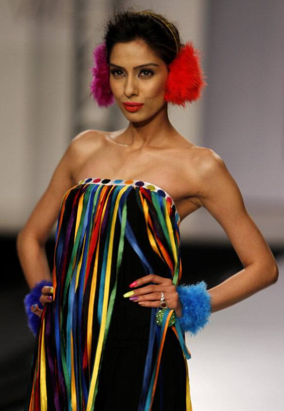 A Pakistani model presents a creation by Pakistani designer Cara, during Bridal Couture Week in Karachi, Pakistan.