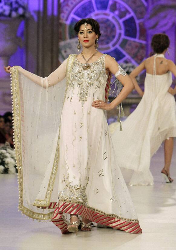 A Pakistani model presents a creation by Pakistani designer Monia Faruqi, during Bridal Couture Week in Karachi, Pakistan.