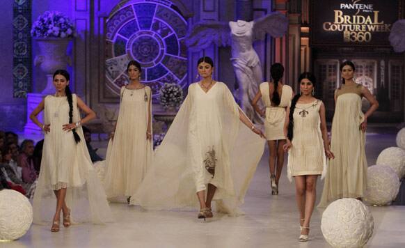 Pakistani models present creations by Pakistani designer Cara, during Bridal Couture Week in Karachi, Pakistan.