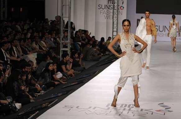 Pakistani models present creations of Pakistani designer Hassan Sheheryar Yasin, during PFDC Sunsilk Fashion Week, in Lahore.